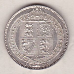 1888 Silver Shilling coin featuring Queen Victoria on the Obverse. The Reverse features the crowned Royal shield within Garter, with divided date below.