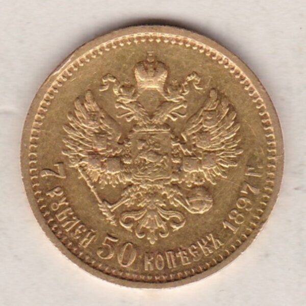 1897 Gold Russia Seven Roubles And Fifty Kopeks coin. The obverse features Emperor Nicholas II. The reverse features the two-headed eagle.