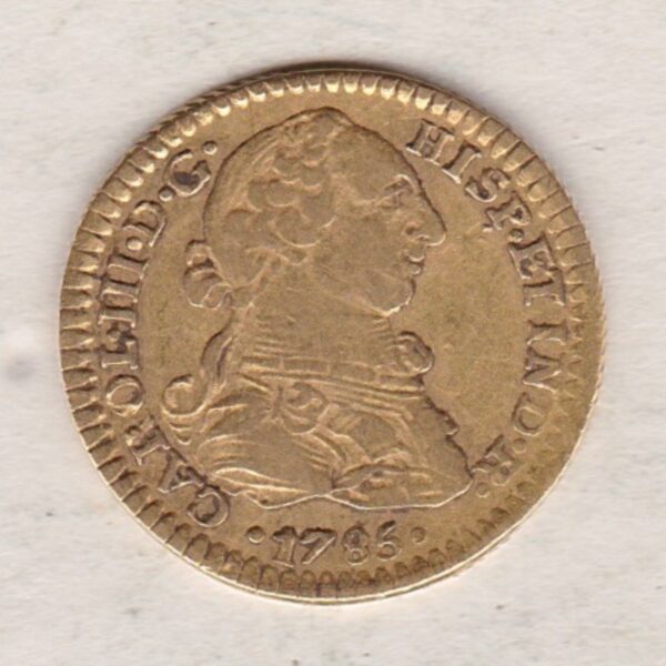 1785 FM Mexico Gold One Escudo coin. The obverse features Carlos III. The reverse features a crowned shield surrounded by a chain.