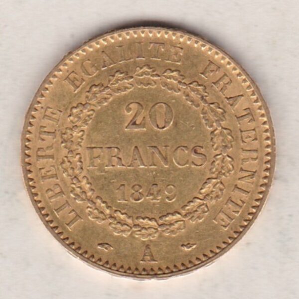 1849 A France Gold Twenty Francs coin featuring a standing Genius writing the Constitution. The reverse has the denomination within a wreath.