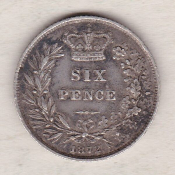 1872 silver sixpence coin featuring young head Queen Victoria on the Obverse. The crowned denomination within a wreath and date below on the Reverse.