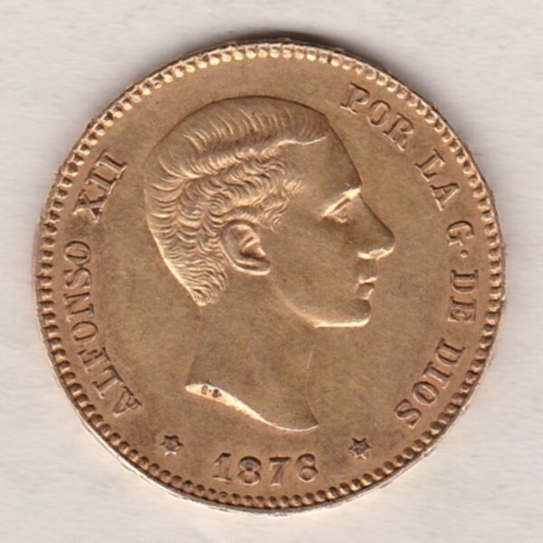 1876 Spain Gold Twenty Five Pesetas coin. The obverse features King Alfonso XII. The reverse features a draped and crowned coat of arms of Spain.