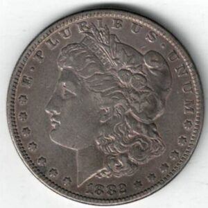 1882 Silver USA Morgan Dollar coin featuring lady liberty on the obverse. The eagle holding arrows and an olive branch on the reverse.