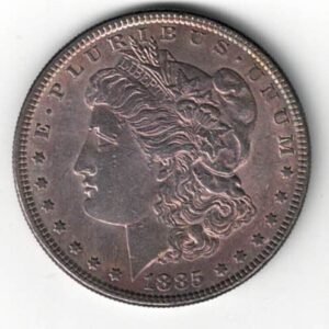 1885 Silver USA Morgan Dollar coin featuring lady liberty on the obverse. The eagle holding arrows and an olive branch on the reverse.