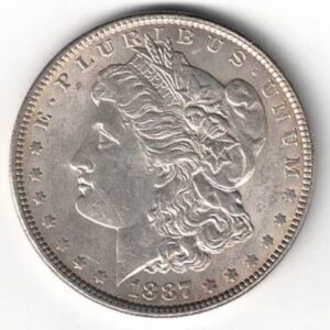 1887 Silver USA Morgan Dollar coin featuring lady liberty on the obverse. The eagle holding arrows and an olive branch on the reverse.