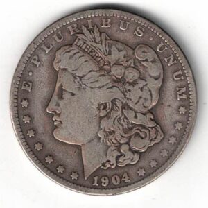 1904 Silver USA Morgan Dollar coin featuring lady liberty on the obverse. The eagle holding arrows and an olive branch on the reverse.