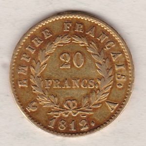 1812 A France Gold Twenty Francs coin featuring the portrait of Napoleon I on the Obverse. The denomination within a wreath on the Reverse.