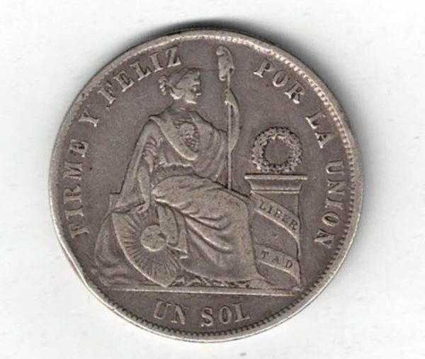 1870 YJ Peru Silver One Sol Coin. The obverse features a small wreath above arms within sprigs and date below. The reverse features seated liberty.