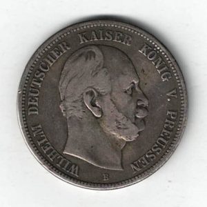 1875 B Germany Silver Five Mark Coin featuring the bust of King Wilhelm I facing left. The reverse features an eagle with the denomination below.