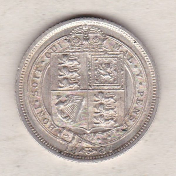1887 Silver Sixpence coin featuring Queen Victoria on the Obverse. The Reverse features a crowned quartered shield of arms.
