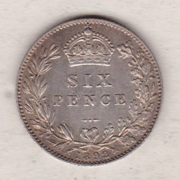 1892 Silver Sixpence coin featuring Queen Victoria on the Obverse. The Reverse features a crowned denomination within wreath.