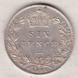 1895 Silver Sixpence coin featuring Queen Victoria on the Obverse. The Reverse features a crowned denomination within wreath.