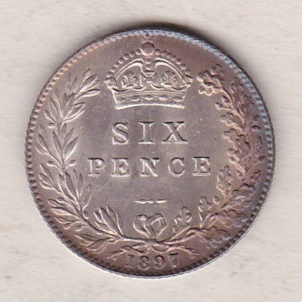 1897 Silver Sixpence coin featuring Queen Victoria on the Obverse. The Reverse features a crowned denomination within wreath.
