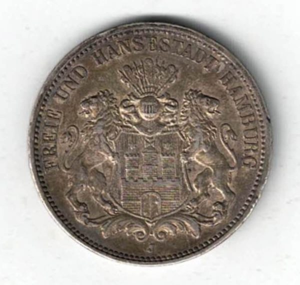 1911 J Germany Silver 3 Mark features features three tower castle on helmeted shield with supporters. The Reverse Crowned imperial eagle, shield on breast