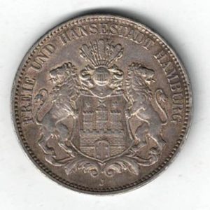 1914 J Germany Silver 3 Mark features features three tower castle on helmeted shield with supporters. The Reverse Crowned imperial eagle, shield on breast