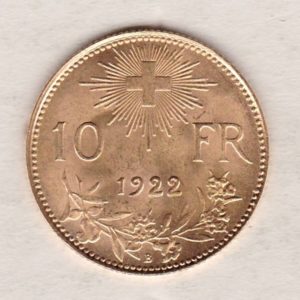 1922 B Switzerland Gold Ten Francs coin features a female figure on the obverse. The Swiss shield surrounded by oak leaves on the Reverse.