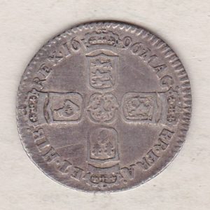 1696 y silver sixpence coin featuring King William III on the obverse. The Reverse is completed with crowned cruciform shields around central lion.