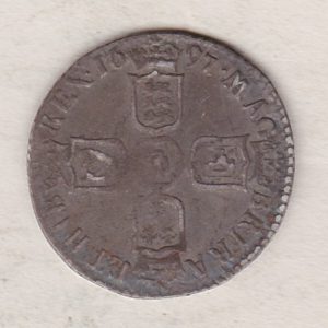1697 E silver sixpence coin featuring King William III on the obverse. The Reverse is completed with crowned cruciform shields around central lion.