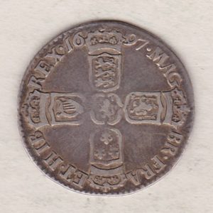 1697 silver sixpence coin featuring King William III on the obverse. The Reverse is completed with crowned cruciform shields around central lion.