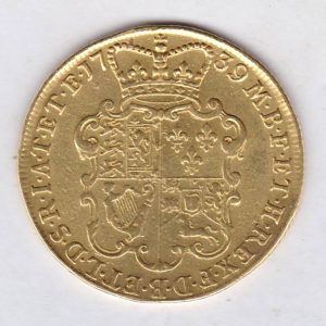 1739 Gold Guinea Coin featuring the portrait of the king George II. The reverse features a crowned quartered shield of arms.