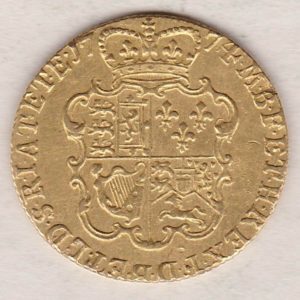 1774 Gold Guinea Coin featuring the fourth laureate head portrait of King George III on the obverse. The crowned quartered shield on the reverse.