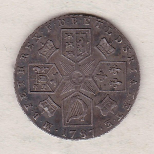 1787 silver sixpence coin featuring a laureate bust of George III. This coin is the variety with no hearts on the Reverse.