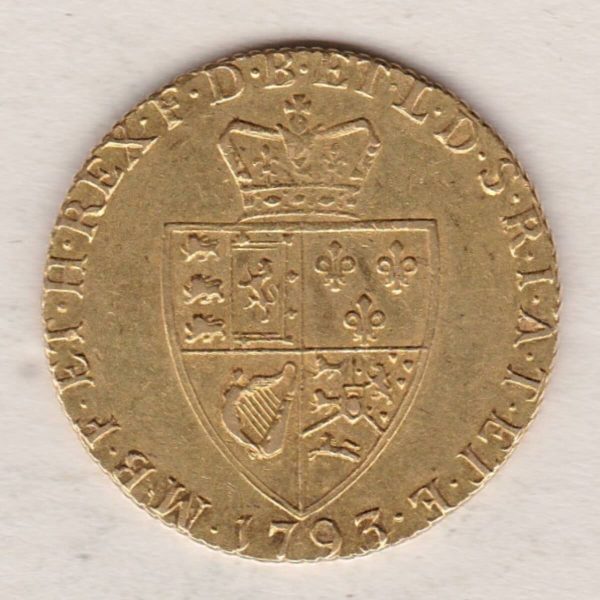 1793 Gold Guinea Coin featuring the fifth laureate head portrait of King George III on the obverse. The spade-shaped shield design is on the reverse.