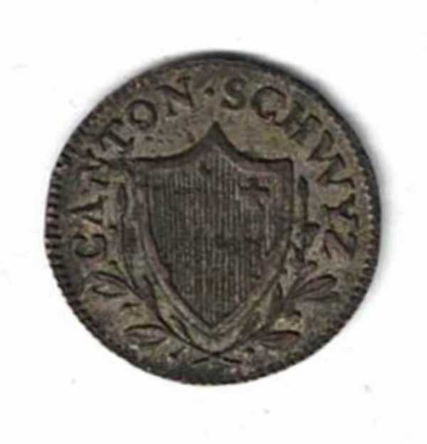 1813 Switzerland Canton Schwyz Billon Two Rappen Coin. The obverse features a pointed shield. The reverse features the denomination & date.