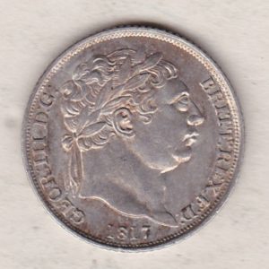 1817 silver sixpence coin featuring King George III on the Obverse. The Reverse features a crowned quartered shield of arms.