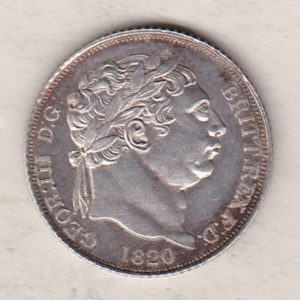 1820 silver sixpence coin featuring King George III on the Obverse. The Reverse features a crowned quartered shield of arms.