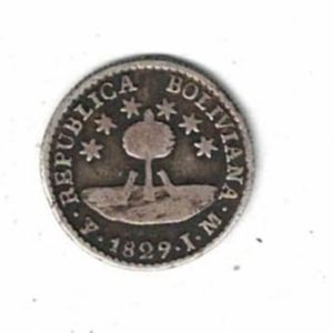 1829 PTS JM Bolivia Silver Half Sol Coin. The obverse features the bust facing right. The reverse features two llamas under a tree.