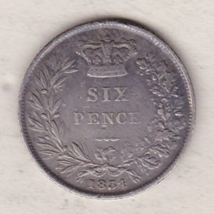 1834 silver sixpence coin featuring King William IV on the Obverse. The crowned denomination within a wreath and date below on the Reverse.
