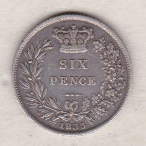 1835 silver sixpence coin featuring King William IV on the Obverse. The crowned denomination within a wreath and date below on the Reverse.