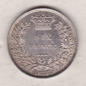 1857 silver sixpence coin featuring young head Queen Victoria on the Obverse. The crowned denomination within a wreath and date below on the Reverse.
