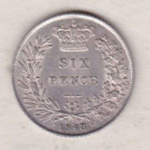 1868 silver sixpence coin featuring young head Queen Victoria on the Obverse. The crowned denomination within a wreath and date below on the Reverse.