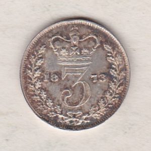 1873 Silver Threepence coin featuring the portrait of Queen Victoria on the Obverse. The Reverse features a crowned denomination dividing the date.