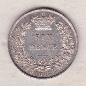 1873 silver sixpence coin featuring young head Queen Victoria on the Obverse. The crowned denomination within a wreath and date below on the Reverse.