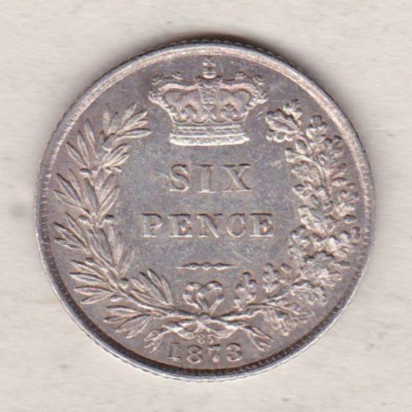 1873 silver sixpence coin featuring young head Queen Victoria on the Obverse. The crowned denomination within a wreath and date below on the Reverse.