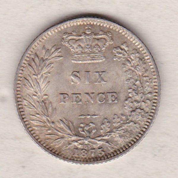 1875 silver sixpence coin featuring young head Queen Victoria on the Obverse. The crowned denomination within a wreath and date below on the Reverse.