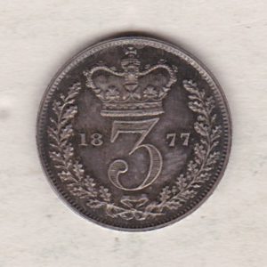 1877 Silver Threepence coin featuring the portrait of Queen Victoria on the Obverse. The Reverse features a crowned denomination dividing the date.