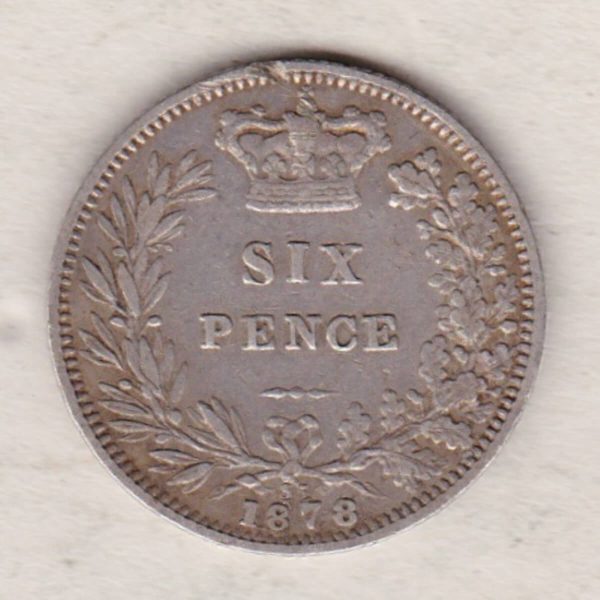 1878 silver sixpence coin featuring young head Queen Victoria on the Obverse. The crowned denomination within a wreath and date below on the Reverse.