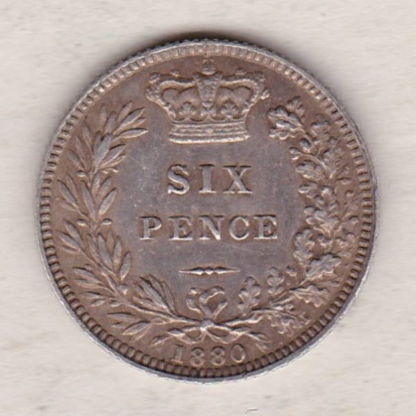 1880 Silver Sixpence coin featuring Queen Victoria on the Obverse. The Reverse features a crowned denomination within wreath.