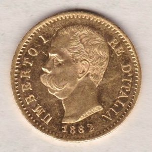 1882 R Italy Gold Twenty Lire coin featuring King Umberto I on the obverse. The crowned Savoy shield of arms on the reverse.
