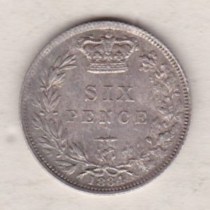 1884 Silver Sixpence coin featuring Queen Victoria on the Obverse. The Reverse features a crowned denomination within wreath.