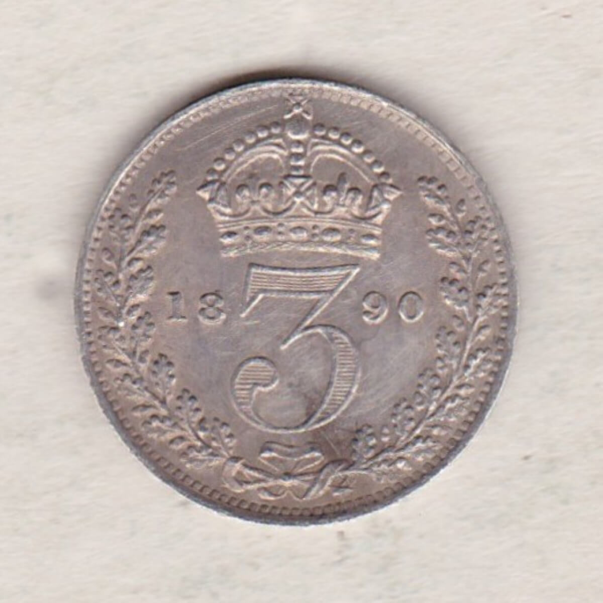 1890 Silver Threepence coin featuring the portrait of Queen Victoria on the Obverse. The Reverse features a crowned denomination dividing the date.