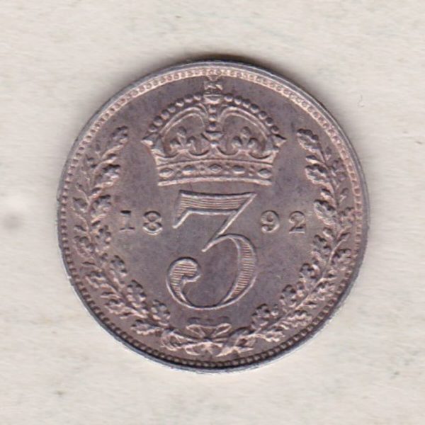 1892 Silver Threepence coin featuring the portrait of Queen Victoria on the Obverse. The Reverse features a crowned denomination dividing the date.