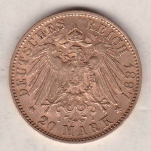 1897 F Germany Gold Twenty Mark coin featuring the bust of Wilhelm II on the obverse. The crowned imperial eagle on the reverse.