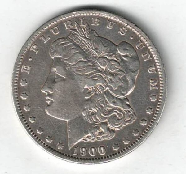 1900 O Silver USA Morgan Dollar coin featuring lady liberty on the obverse. The eagle holding arrows and an olive branch on the reverse.