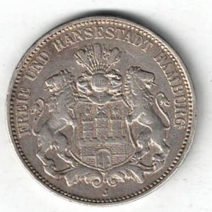 1909 J Germany Silver 3 Mark features features three tower castle on helmeted shield with supporters. The Reverse Crowned imperial eagle, shield on breast