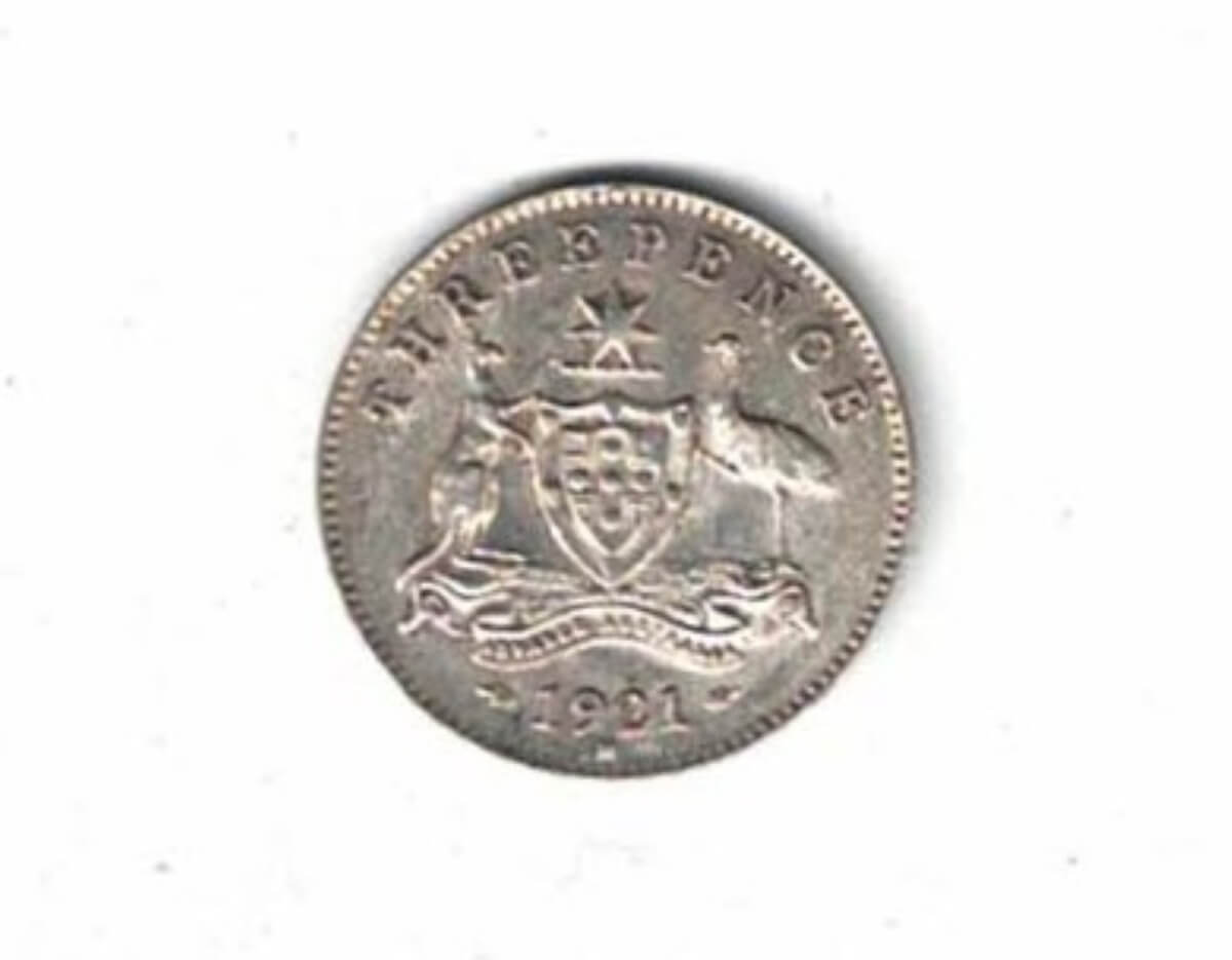 1921 M Australia Silver Threepence Coin. The obverse features the bust of George V facing left. the reverse features the Australia coat of arms.